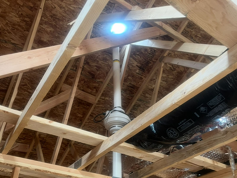Clean attic radon fan installation with proper ventilation